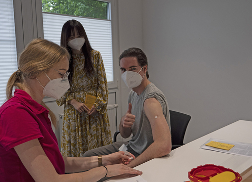 Company doctors vaccinate employees and family members